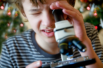 Image showing Young boy with christmas present