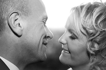 Image showing Happy bride and groom kissing