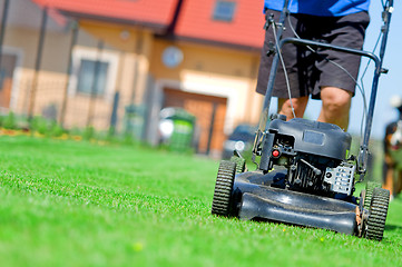 Image showing Mowing the lawn