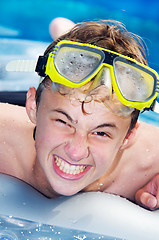 Image showing Playful boy in a pool