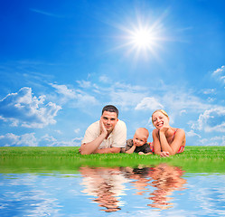 Image showing Happy family together on grass