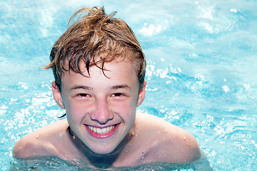 Image showing Happy boy in a pool