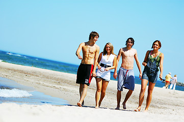 Image showing Young friends on the summer beach