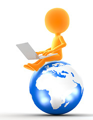 Image showing Gold man sitting on the globe with laptop