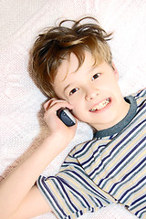 Image showing Teen boy talking on cell phone