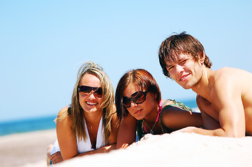 Image showing Young friends on the summer beach