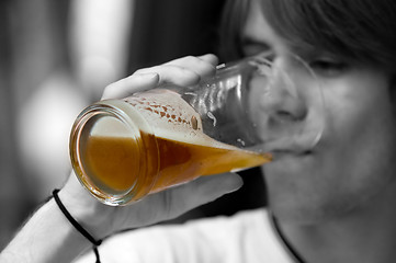 Image showing Teenager drinking beer