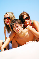 Image showing Young friends on the summer beach