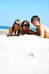 Image showing Young friends on the summer beach