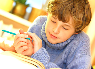 Image showing Boy doing homework