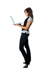 Image showing Businesswoman standing surprised with laptop