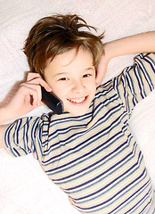 Image showing Teen boy talking on cell phone