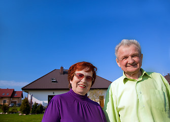 Image showing Senior couple in front of the house