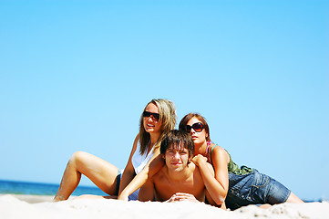 Image showing Young friends on the summer beach