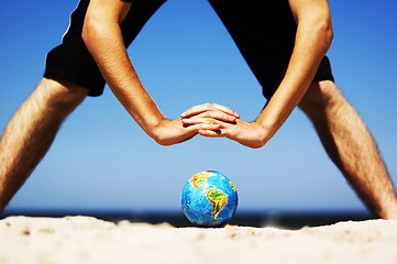 Image showing Earth globe with hands over it. Conceptual image