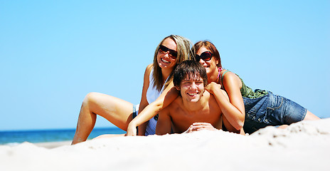 Image showing Young friends on the summer beach