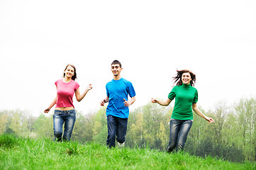 Image showing Happy friends jumping