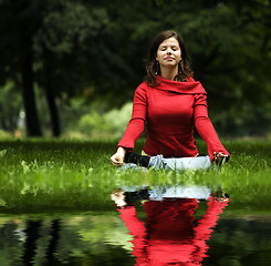Image showing Young woman doing yoga