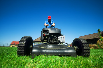 Image showing Mowing the lawn