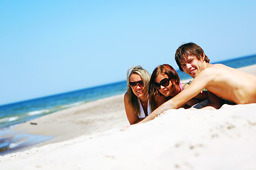 Image showing Young friends on the summer beach