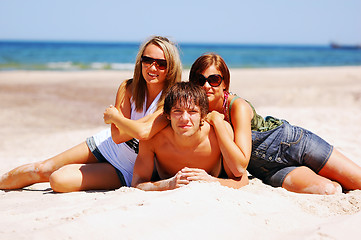 Image showing Young friends on the summer beach