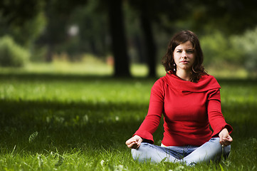 Image showing Young woman doing yoga