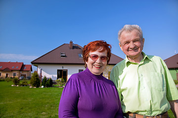 Image showing Senior couple in front of the house