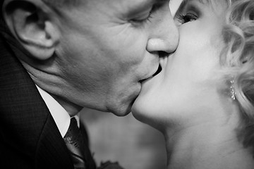 Image showing Happy bride and groom kissing