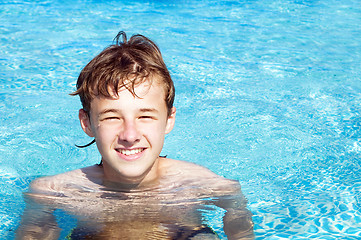 Image showing Happy boy in a pool