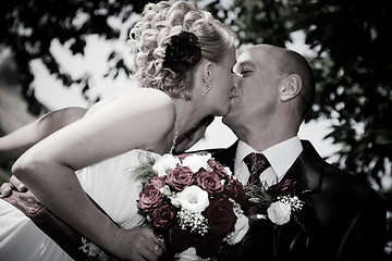 Image showing Happy bride and groom kissing