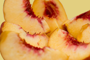 Image showing Slices of peach isolated, focus on center