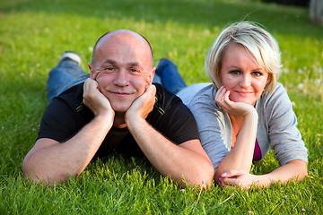 Image showing Adult happy couple together on grass