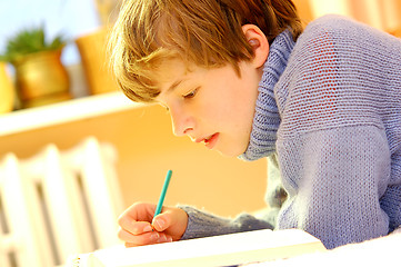 Image showing Boy doing homework