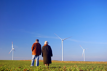 Image showing Seniors' couple and wind turbines