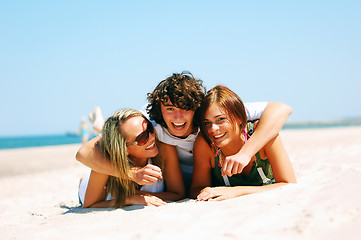 Image showing Young friends on the summer beach