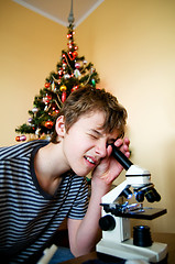 Image showing Young boy with christmas present