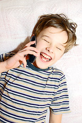 Image showing Teen boy talking on cell phone