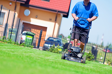 Image showing Mowing the lawn