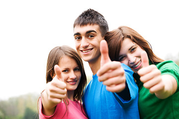 Image showing Happy friends giving okey sign