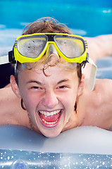 Image showing Playful boy in a pool