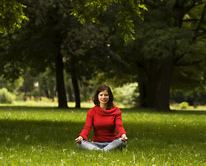 Image showing Young woman doing yoga