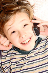 Image showing Teen boy talking on cell phone