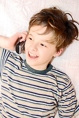Image showing Teen boy talking on cell phone