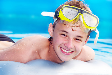 Image showing Happy boy in a pool