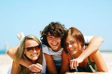 Image showing Young friends on the summer beach