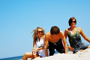 Image showing Young friends on the summer beach