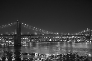 Image showing Lights of New York City and Brooklyn Bridge at Sunset