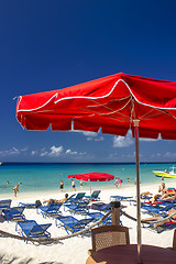 Image showing Red Beach Umbrellas and turquoise Waters of Caribbean