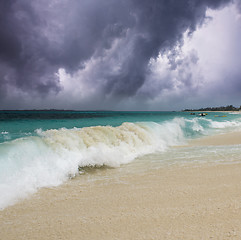 Image showing Wave on the Beach with Storm in the Background