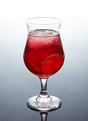 Image showing glass of fresh red cocktail with lime and ice